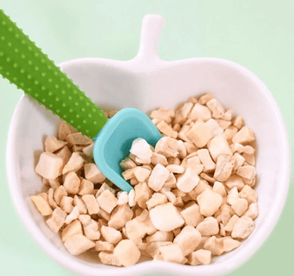 Close-up of a GoSili silicone spoon with textured handle for a secure grip.
