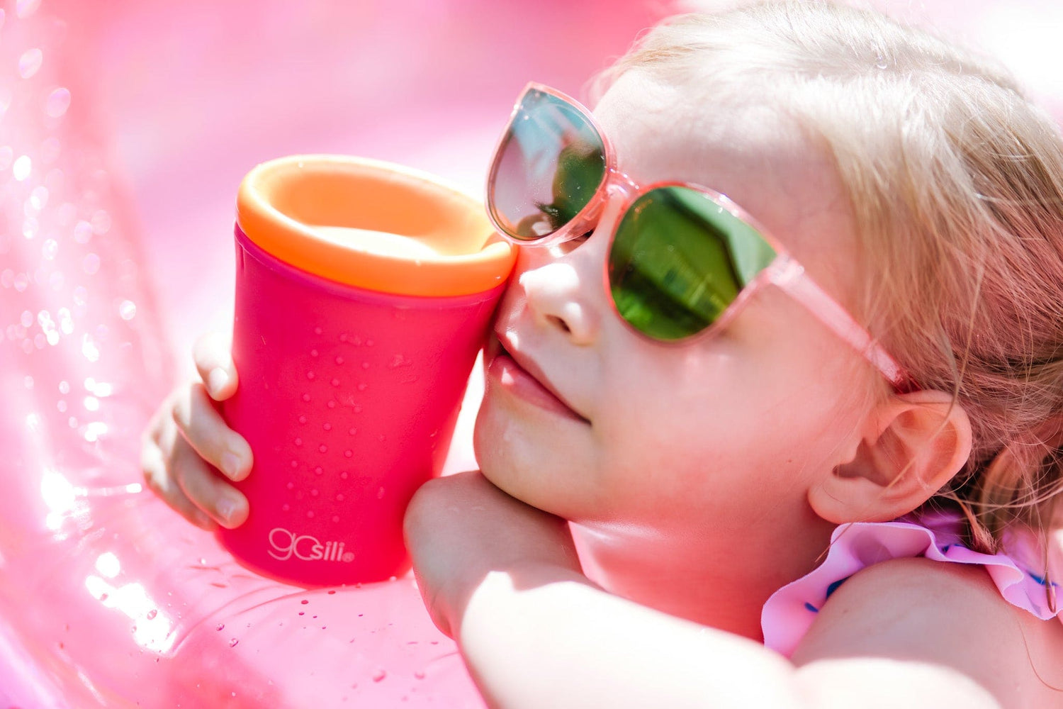 Child holding a GoSili silicone cup with a non-collapsible design.