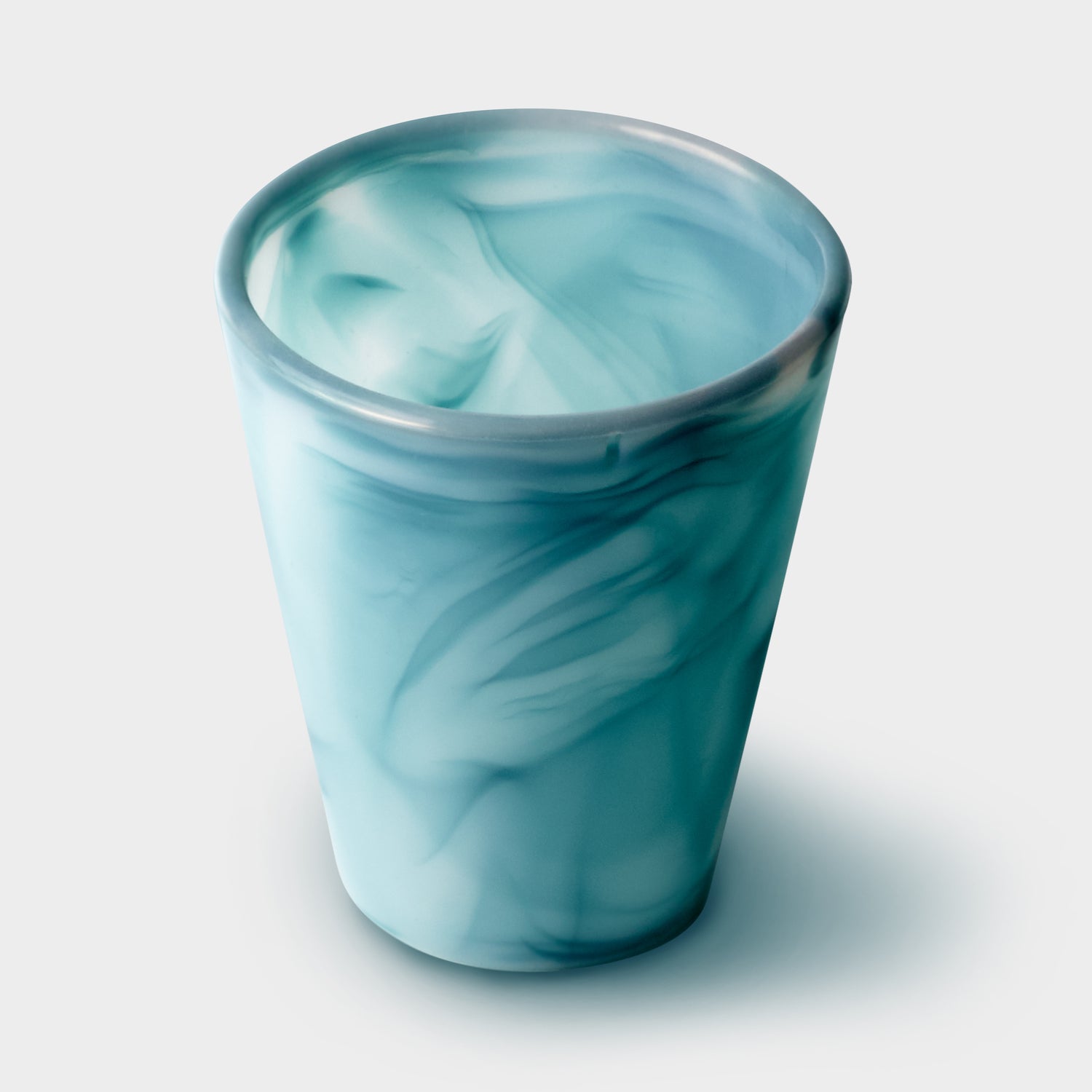 Close-up of GoSili reusable silicone cup with one-of-a-kind water design.
