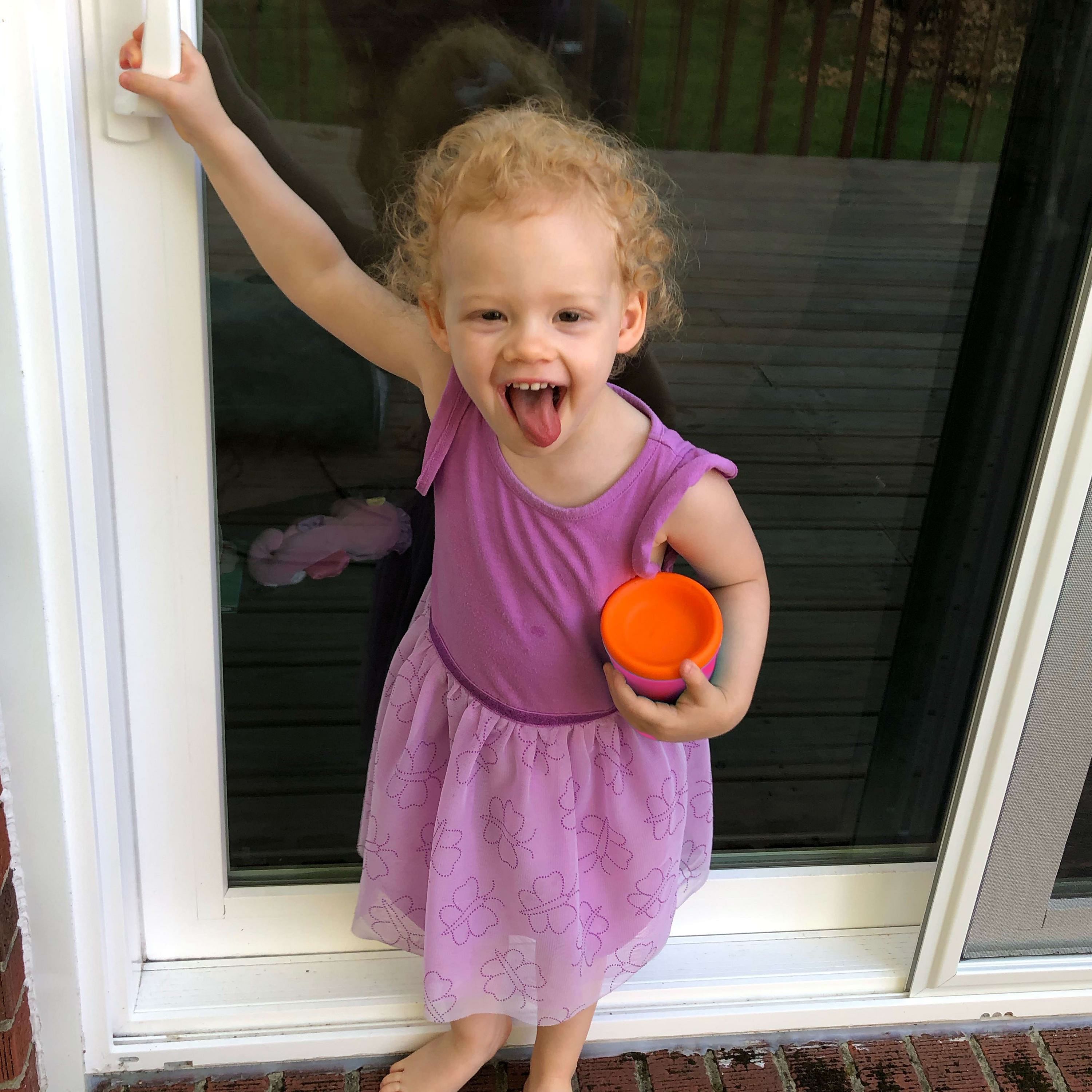 Child holding a GoSili silicone cup with a non-collapsible design.